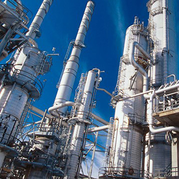 Large industrial refinery towers and pipes